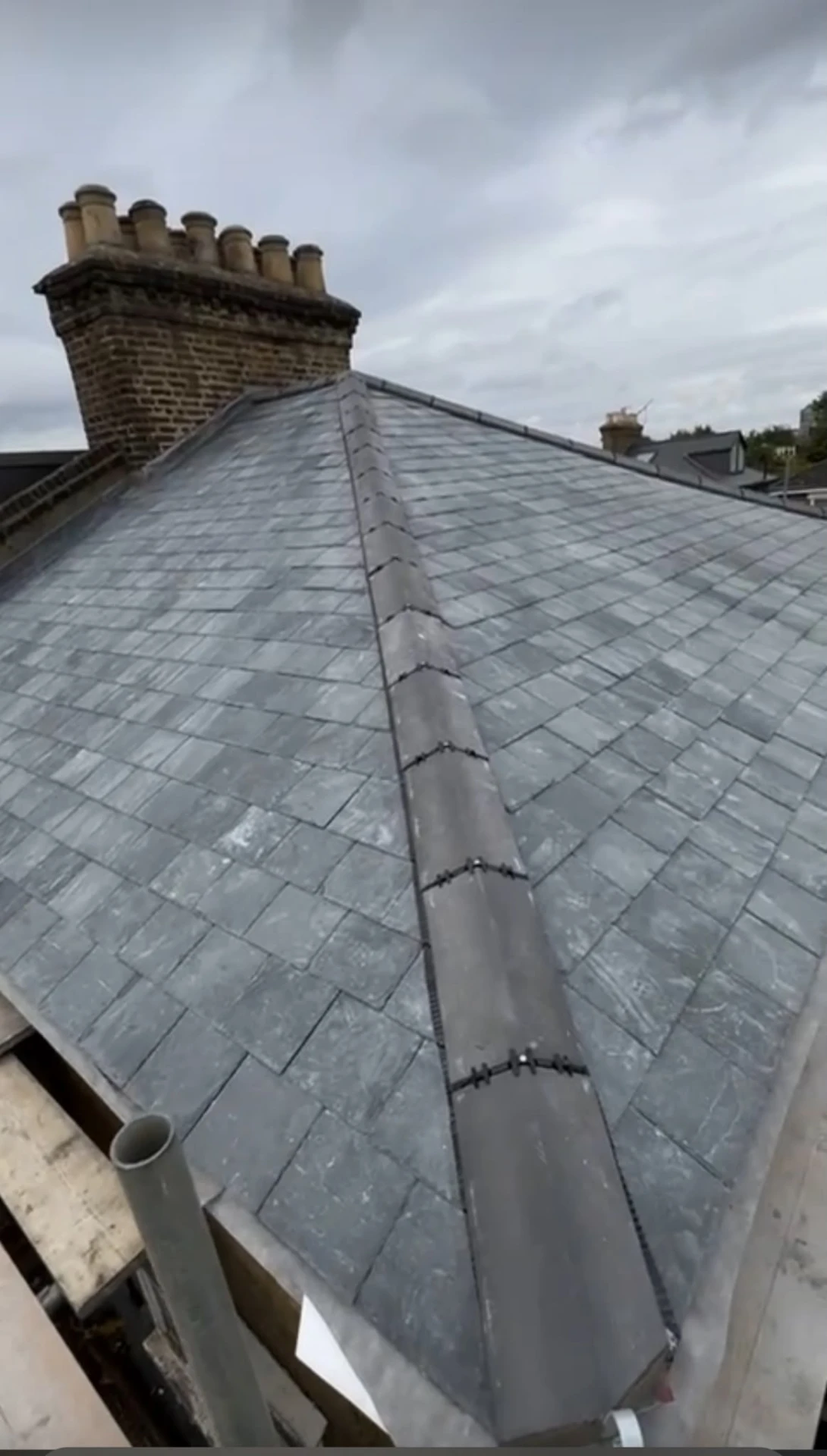Finished natural slate roof with ridge